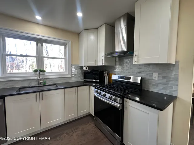 a bathroom with a sink and mirror