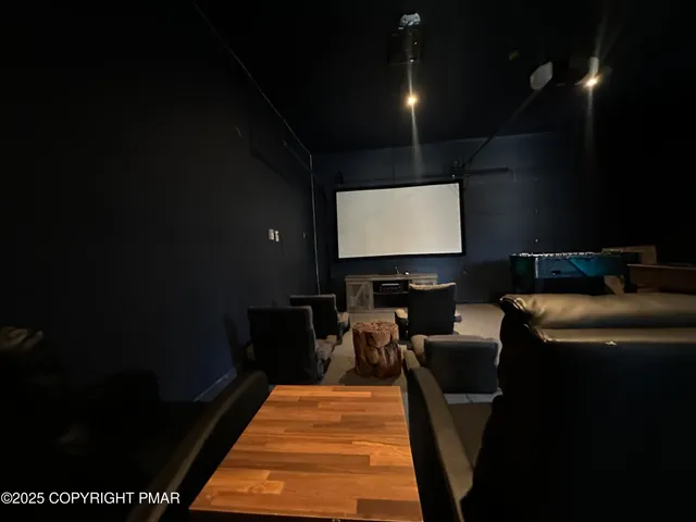 a bedroom with two beds and wooden floor