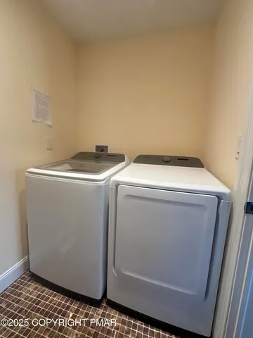 a bed room with a bed and a chair