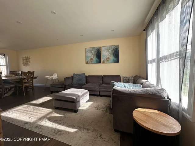 a living room with furniture fireplace and a flat screen tv