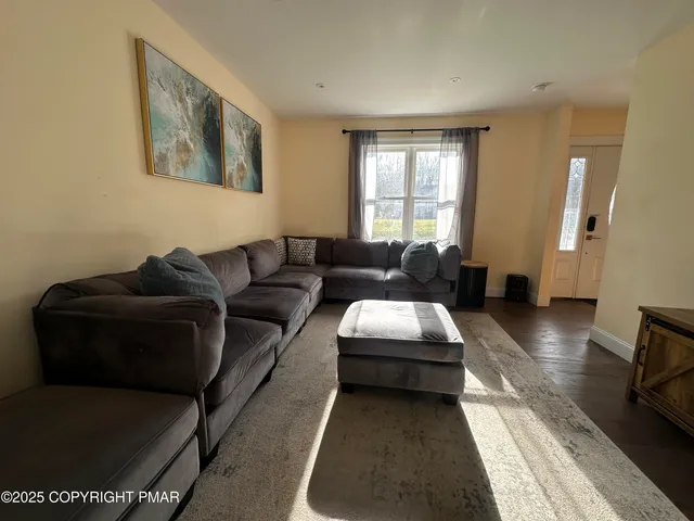a view of a dining room with furniture and window