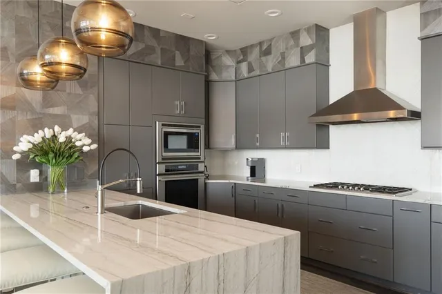 a kitchen with a sink and cabinets