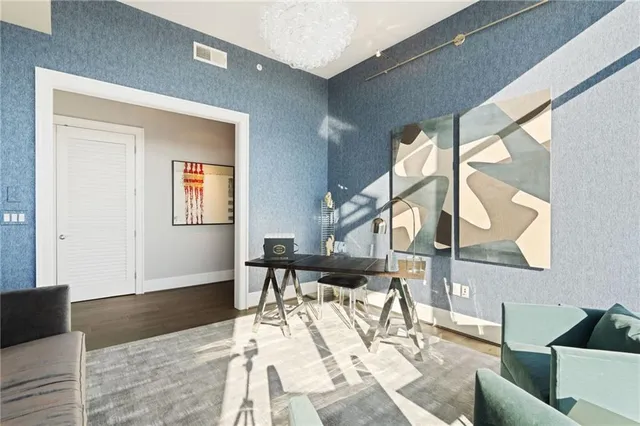 a bedroom with a bed and a night stand