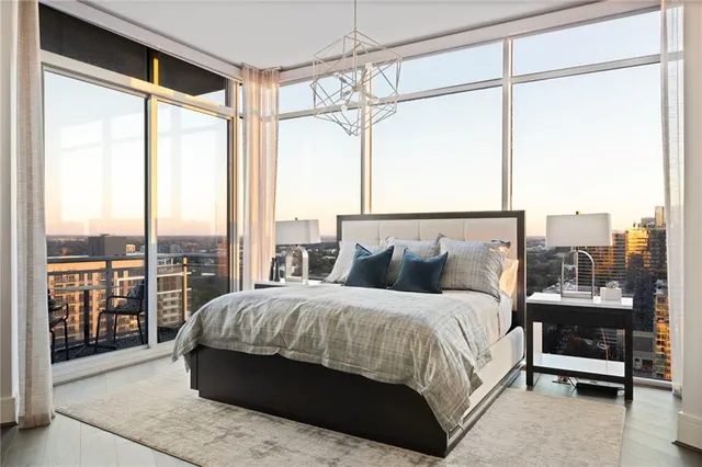 a bedroom with a large bed and a walk in closet