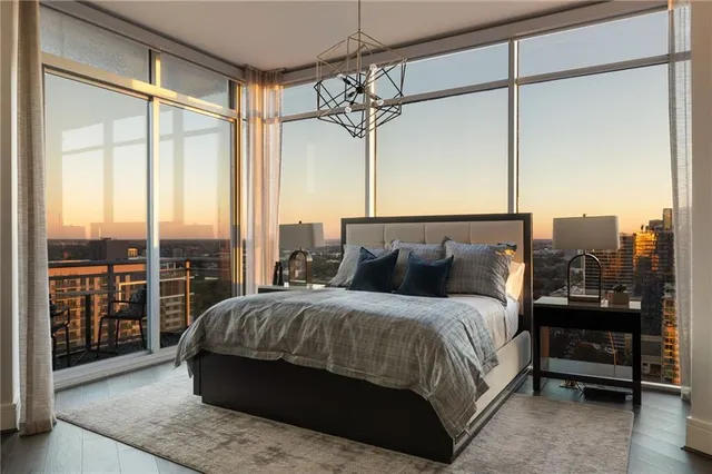 a bedroom with a bed and a flat tv screen