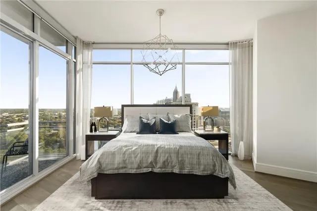 a spacious bedroom with a large bed and a window