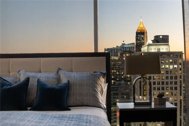 a bedroom with a bed and a tv