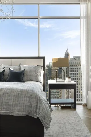 a en suite bathroom with a granite countertop sink and a mirror