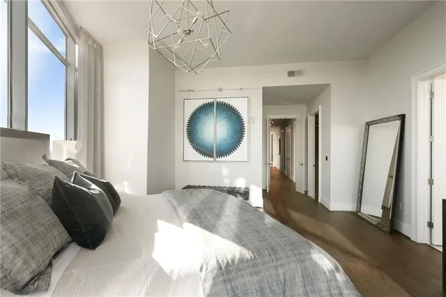 a bathroom with a double vanity sink toilet and a mirror