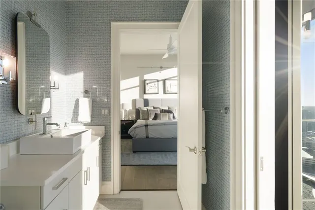 a view of swimming pool with outdoor seating and city view