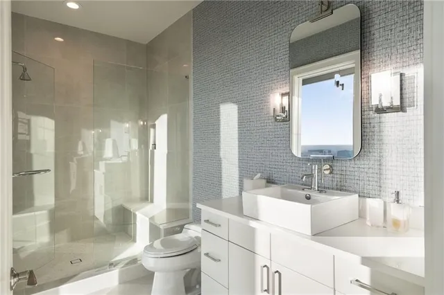 a living room with furniture a flat screen tv and a large window