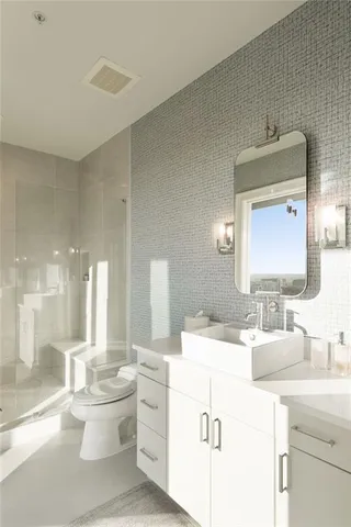 a large kitchen with a table and chairs