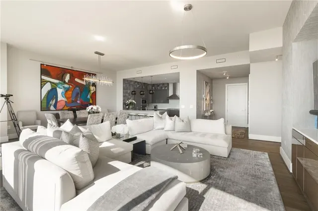 a kitchen with stainless steel appliances a sink a stove and cabinets