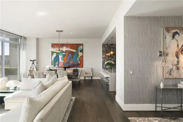 a kitchen with stainless steel appliances granite countertop a sink and a refrigerator