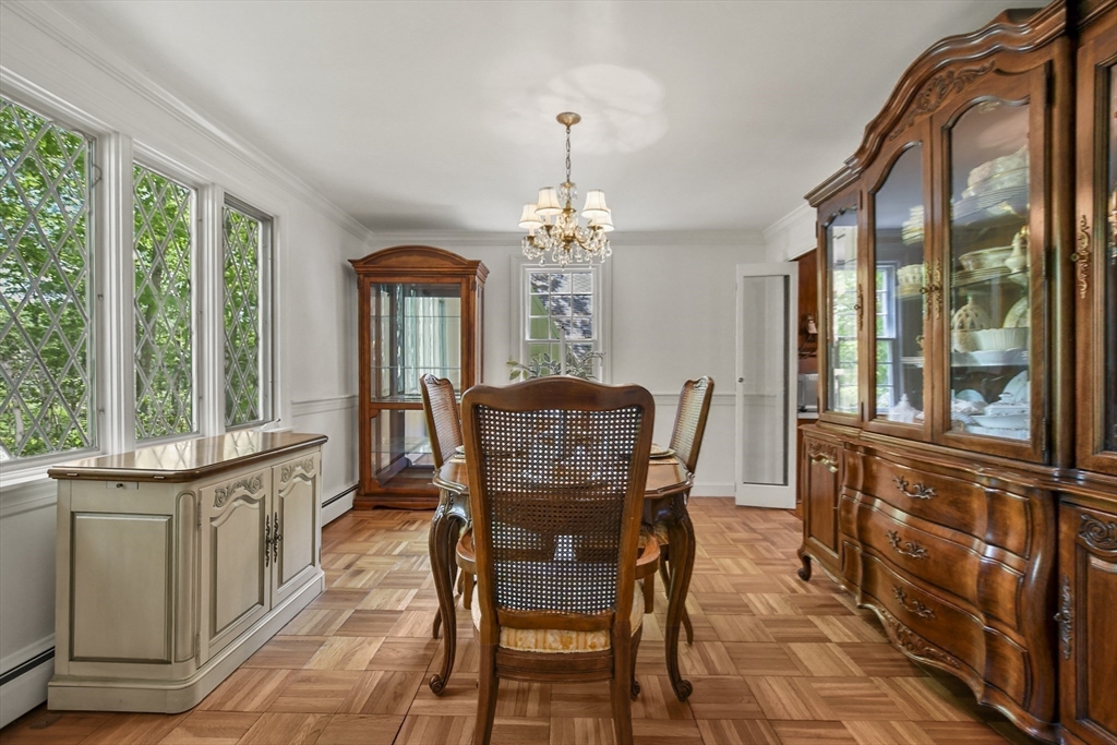 40 Herrick Road Boxford, MA 01921 - Photo 17 of 40 a view of a dining room with furniture a chandelier and wooden floor