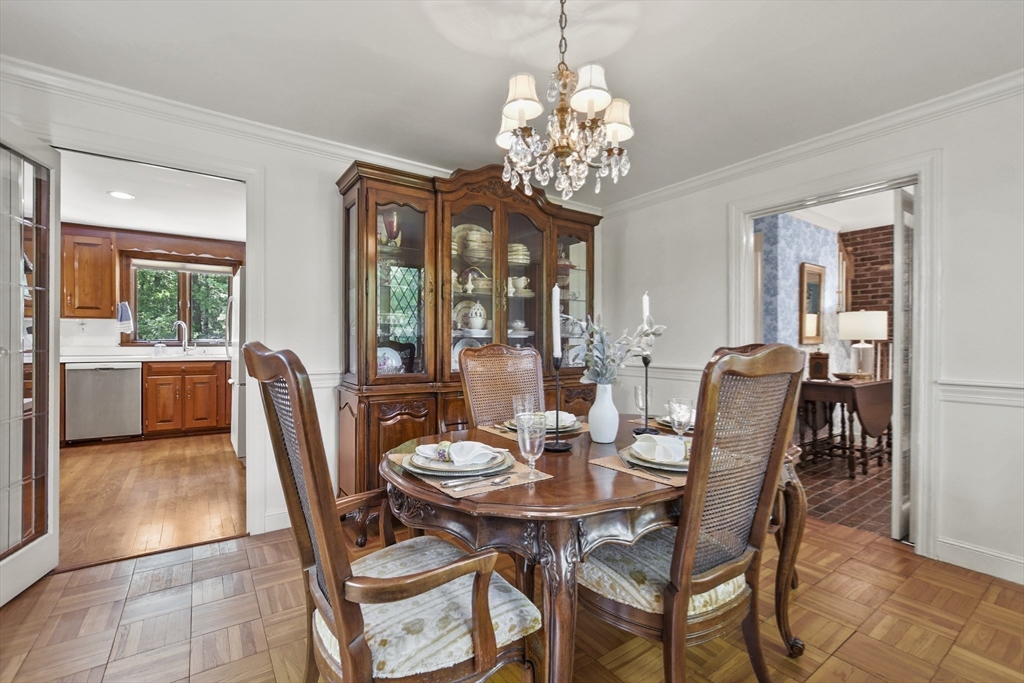40 Herrick Road Boxford, MA 01921 - Photo 18 of 40 a view of a dining room with furniture a chandelier and wooden floor