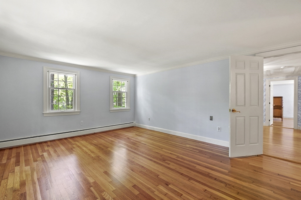 40 Herrick Road Boxford, MA 01921 - Photo 21 of 40 an empty room with wooden floor and windows