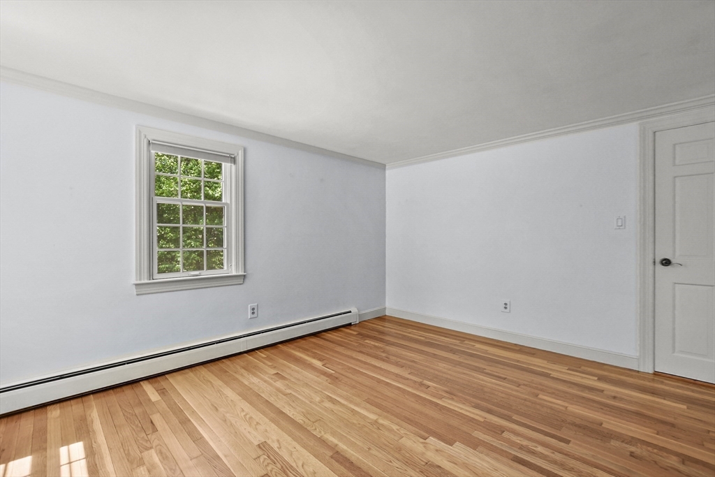 40 Herrick Road Boxford, MA 01921 - Photo 24 of 40 a view of an empty room with wooden floor and a window