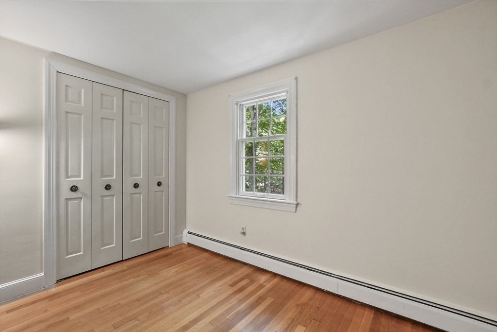 40 Herrick Road Boxford, MA 01921 - Photo 27 of 40 a view of an empty room with wooden floor and a window