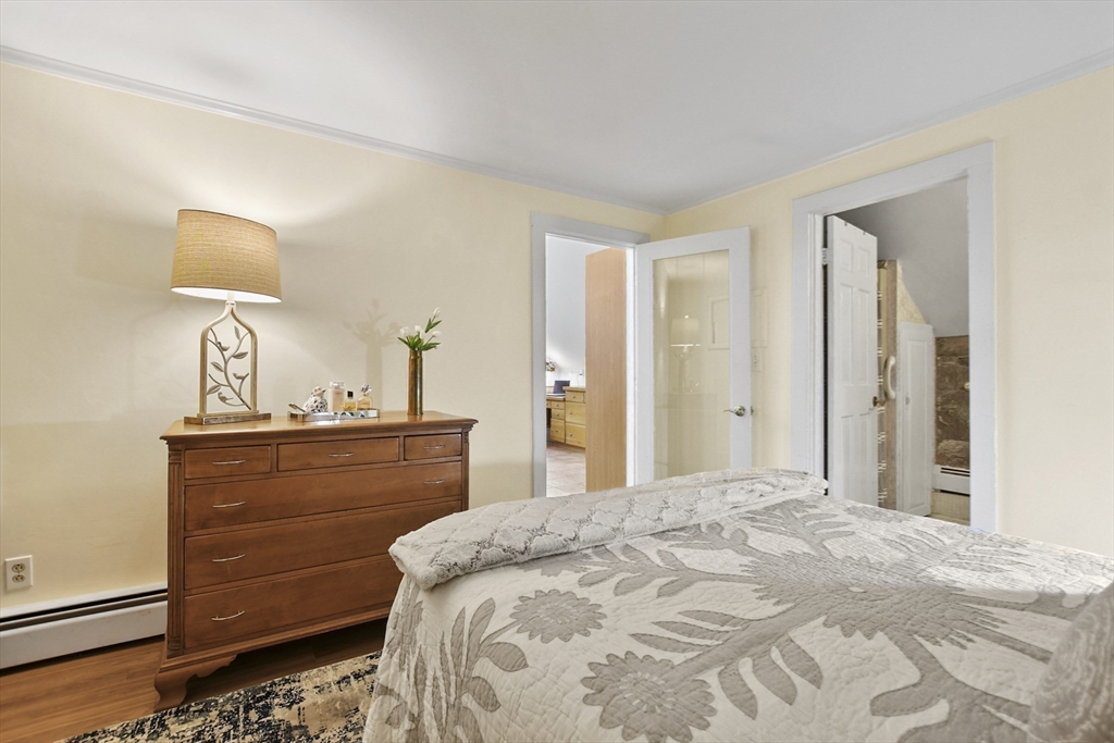 40 Herrick Road Boxford, MA 01921 - Photo 35 of 40 a bedroom with a bed and a dresser