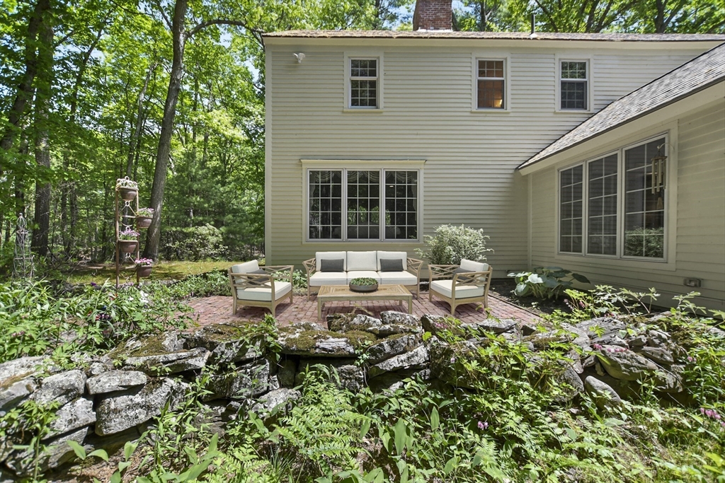 40 Herrick Road Boxford, MA 01921 - Photo 37 of 40 a view of a house with sitting area and garden