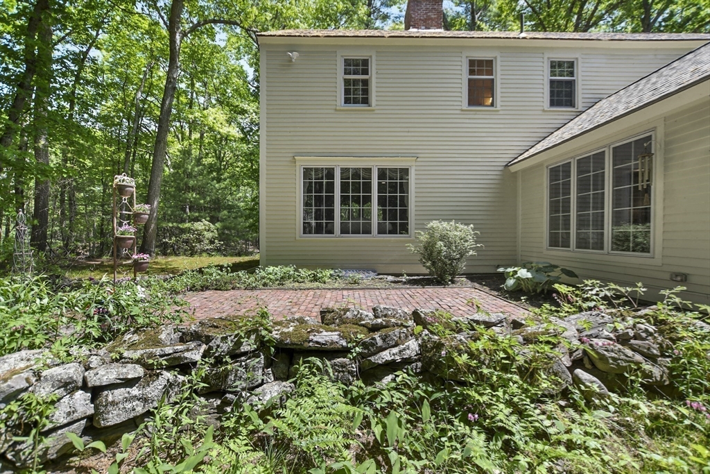 40 Herrick Road Boxford, MA 01921 - Photo 38 of 40 a front view of a house with a yard