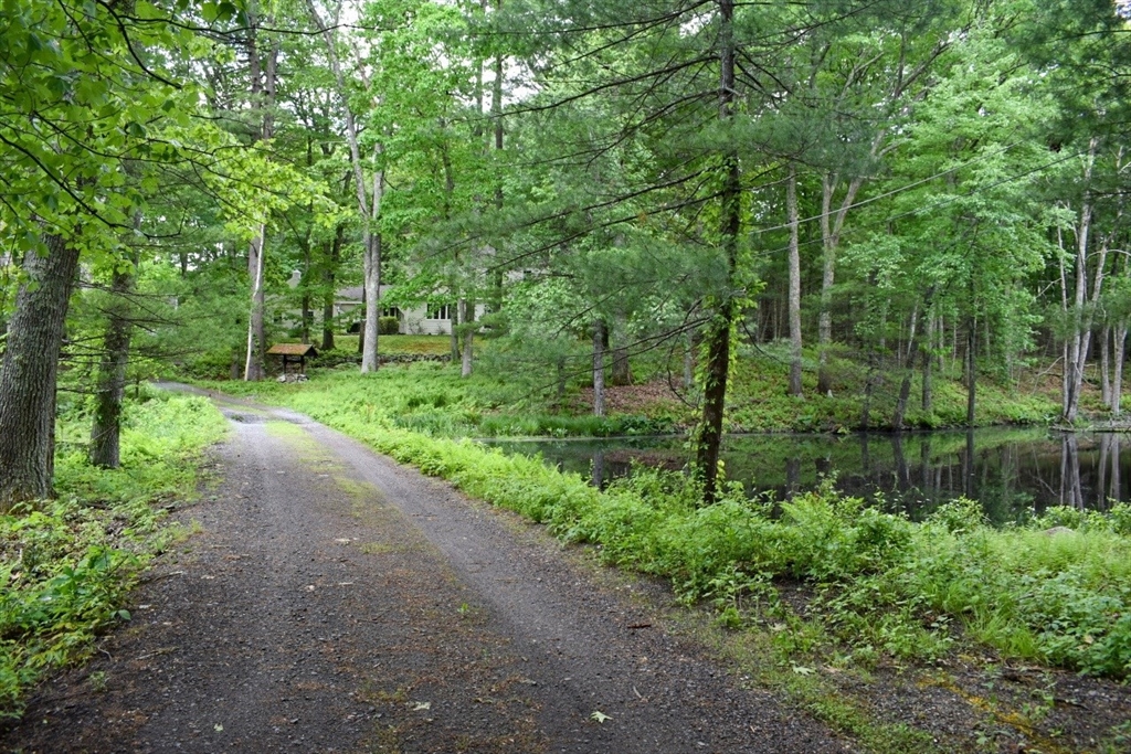 40 Herrick Road Boxford, MA 01921 - Photo 40 of 40 a view of a park with large trees and plants