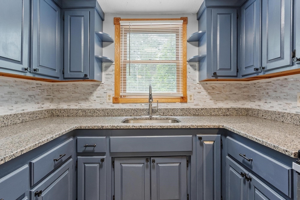 258 Allen Road Ashby, MA 01431 - Photo 7 of 36 a kitchen with granite countertop cabinets sink and window