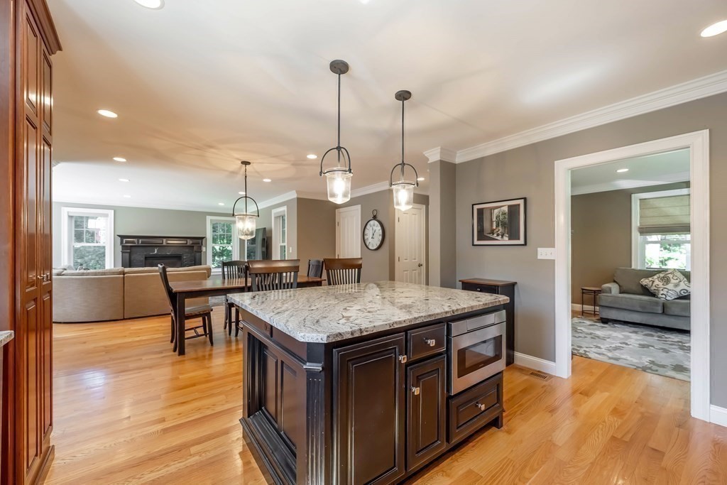 20 County Road Andover, MA 01810 - Photo 11 of 42 a kitchen with a stove center island with the wooden floor
