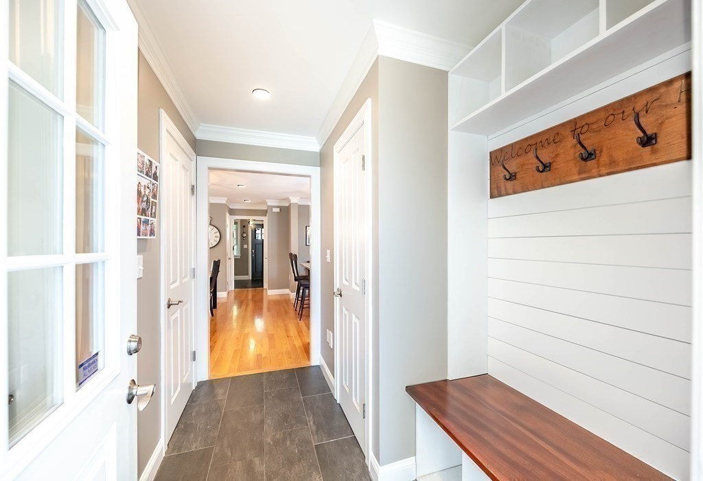 20 County Road Andover, MA 01810 - Photo 24 of 42 a view of a hallway with wooden floor and a bathroom