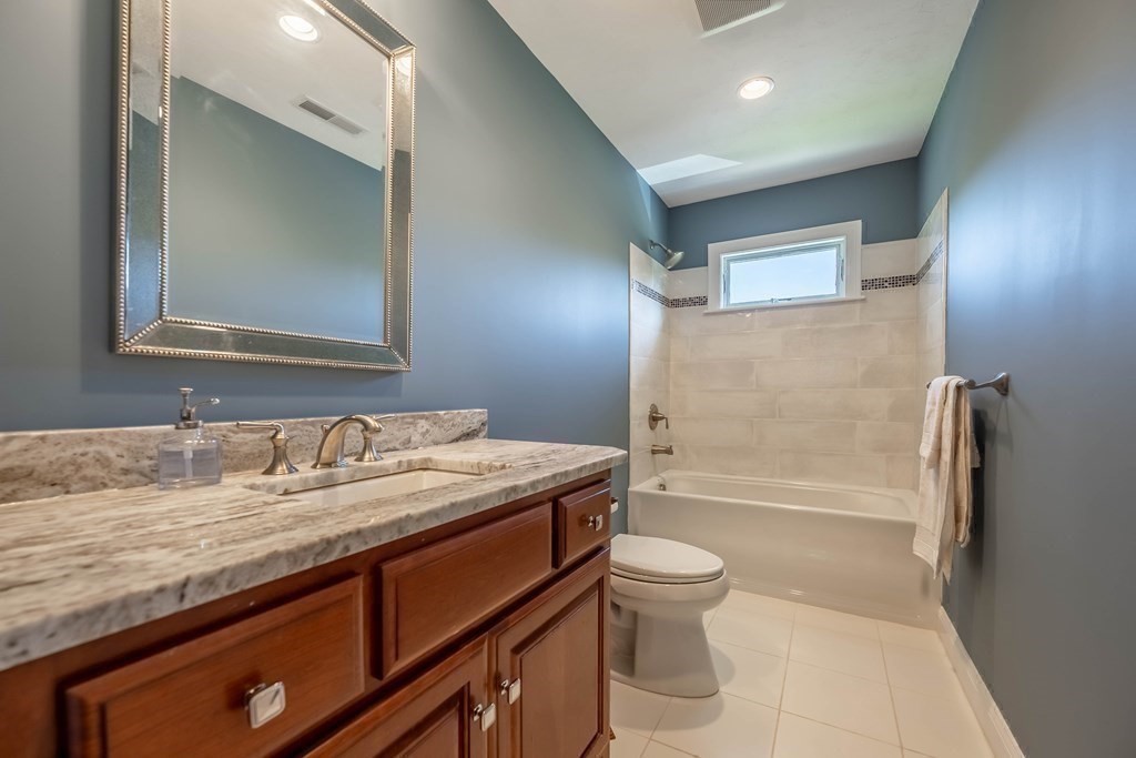 20 County Road Andover, MA 01810 - Photo 33 of 42 a bathroom with a granite countertop sink toilet and shower