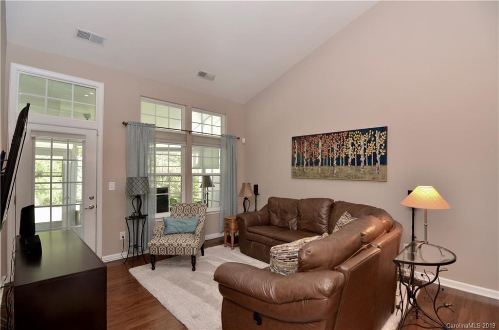 113 Inlet Point Drive Tega Cay, SC 29708 - Photo 14 of 42 a living room with furniture and a large window