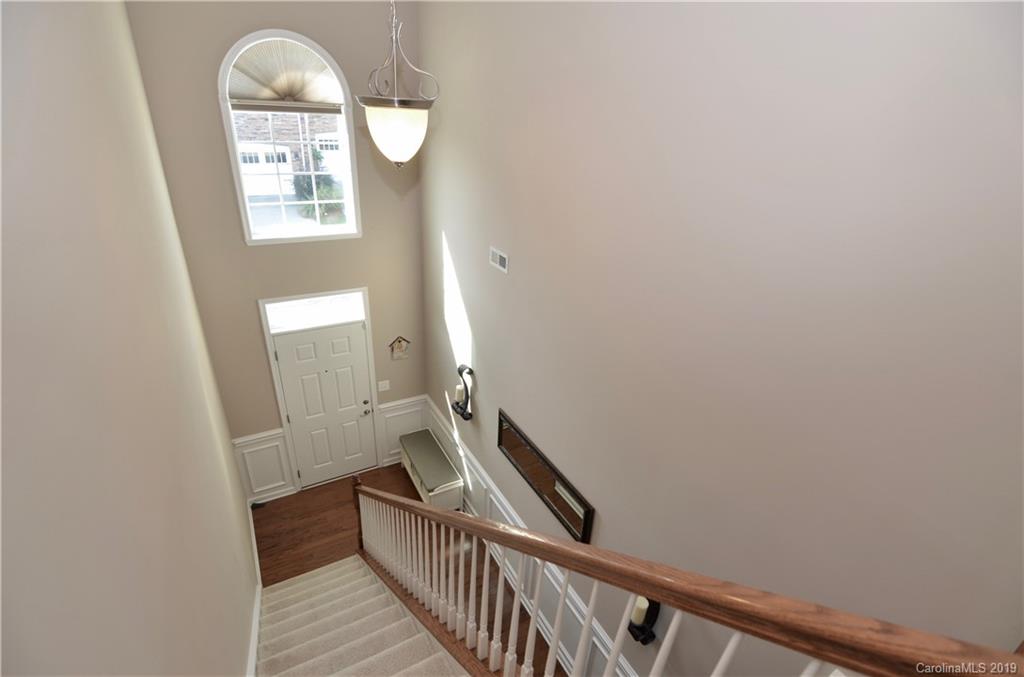 113 Inlet Point Drive Tega Cay, SC 29708 - Photo 3 of 42 a view of entryway with a window and wooden floor