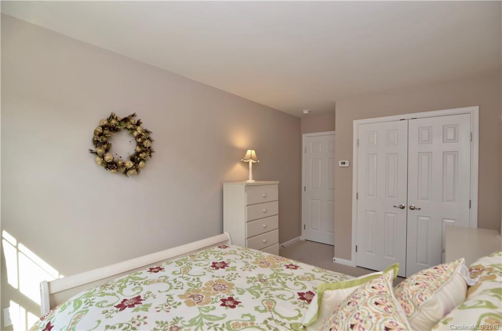 113 Inlet Point Drive Tega Cay, SC 29708 - Photo 26 of 42 a bedroom with bed and window