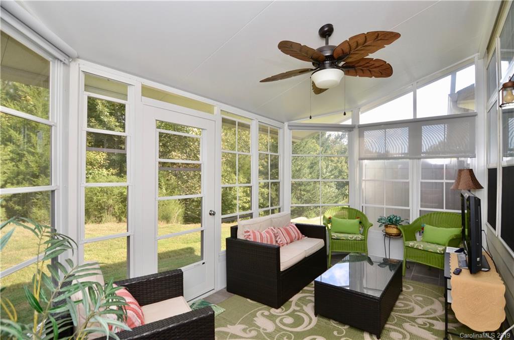 113 Inlet Point Drive Tega Cay, SC 29708 - Photo 31 of 42 a living room with furniture and a large window