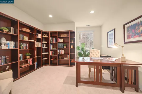 a view of a livingroom with furniture and staircase
