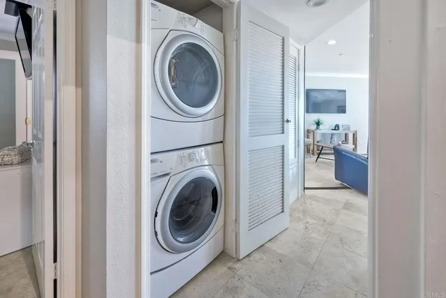 a view of a hallway with washer and dryer