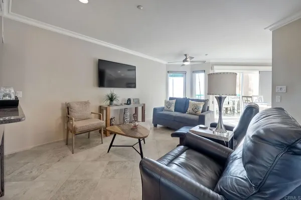 a living room with furniture and a flat screen tv