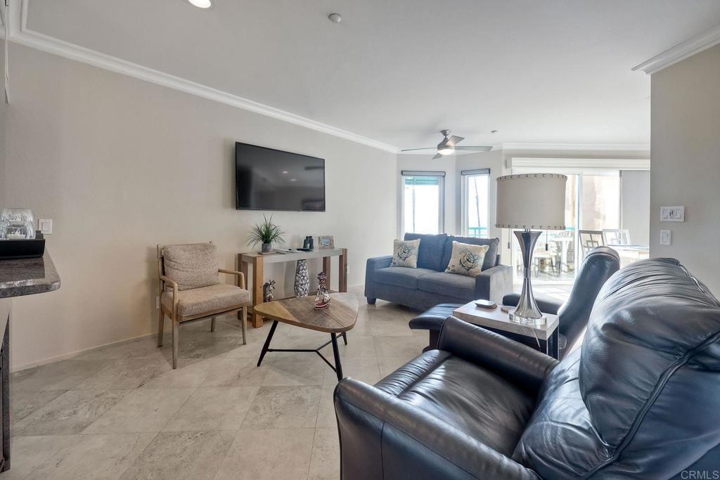 400 The Strand North, Unit 18 Oceanside, CA 92054 - Photo 6 of 19 a living room with furniture and a flat screen tv