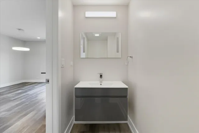 a bathroom with a sink and a mirror