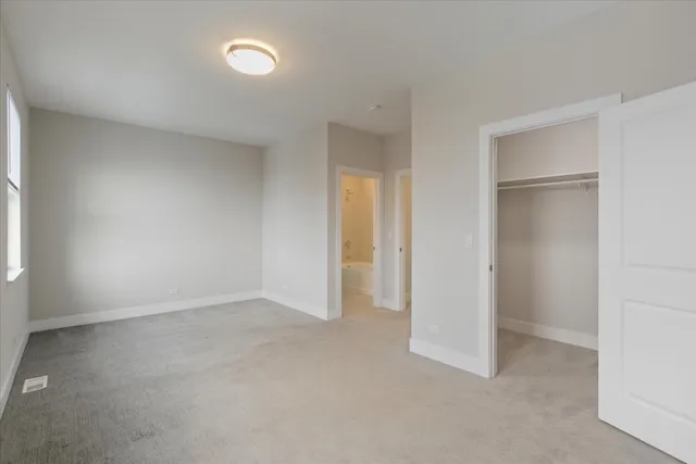 an empty room with closet area