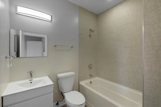 a bathroom with a sink toilet and bathtub