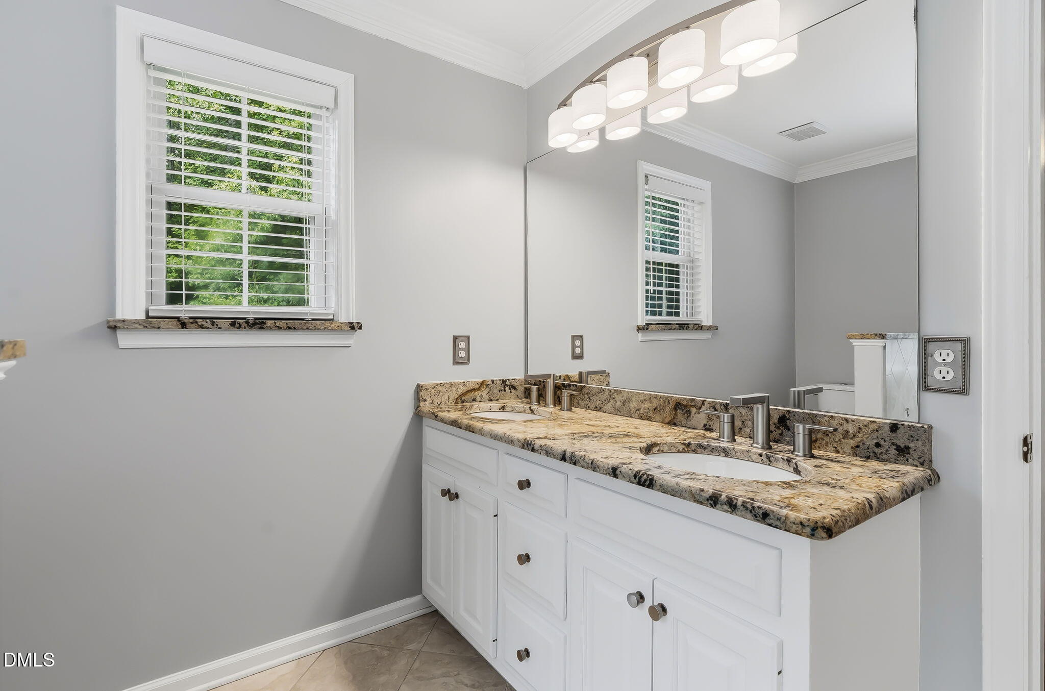 1112 Tyler Farms Drive Raleigh, NC 27603 - Photo 31 of 78 a bathroom with a granite countertop sink and a mirror
