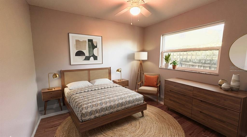 11333 Walsingham Road Largo, FL 33778 - Photo 19 of 34 a bedroom with a bed and wooden floor