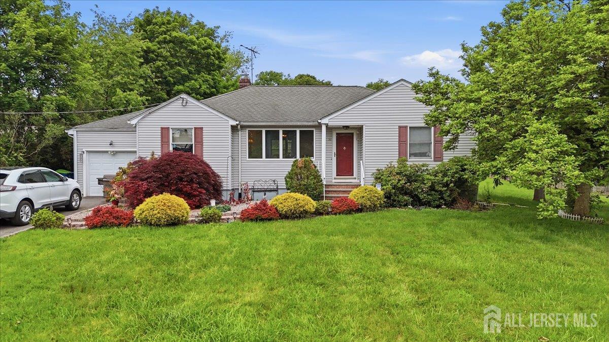 a front view of house with yard and green space