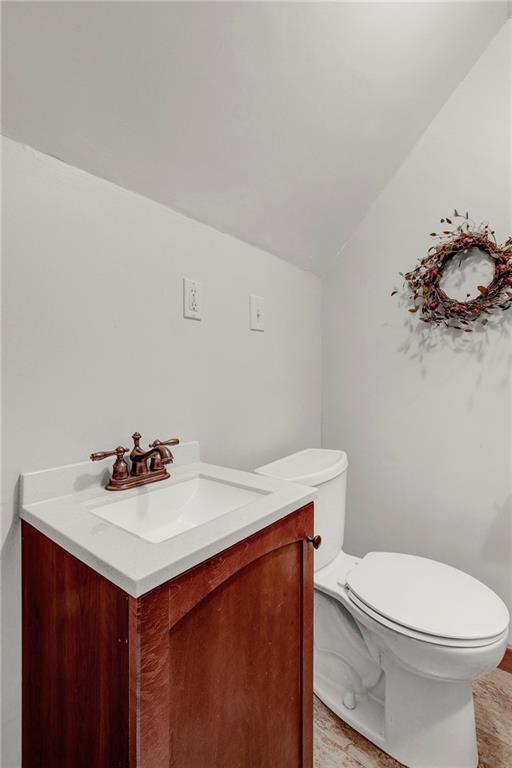 1400 Market Street Beaver, PA 15009 - Photo 15 of 23 a bathroom with a sink a toilet and vanity