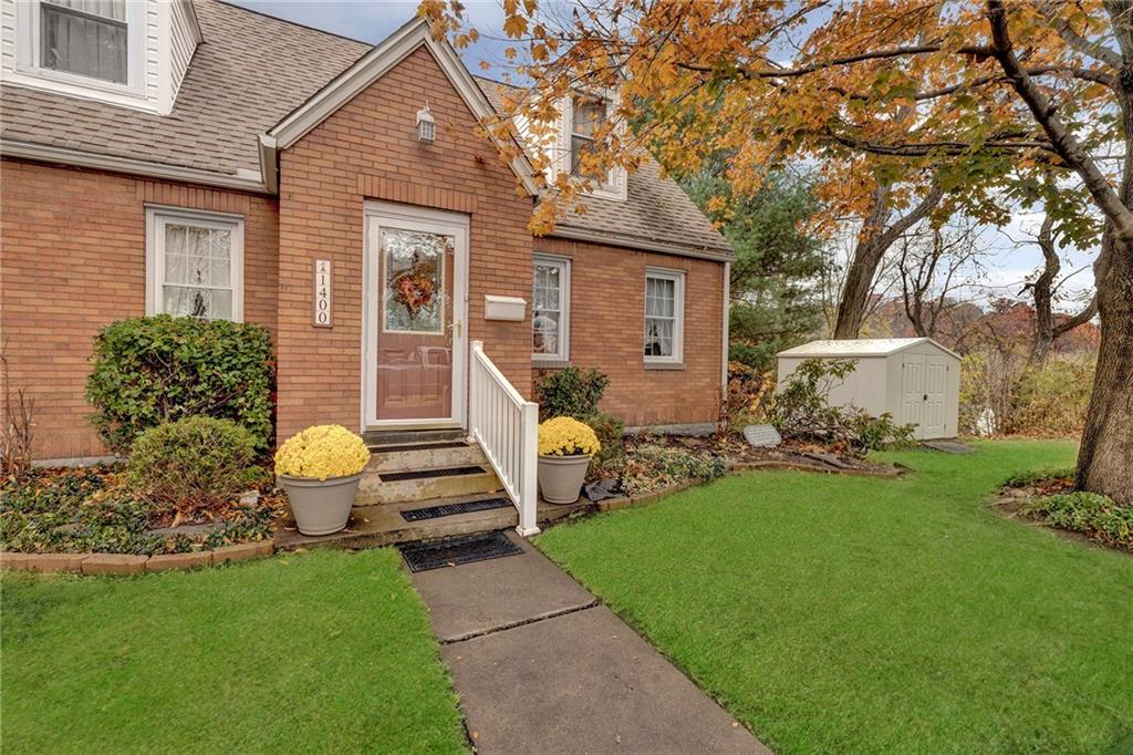 1400 Market Street Beaver, PA 15009 - Photo 23 of 23 a front view of a house with garden