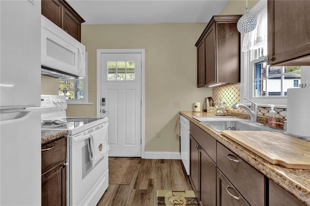 1400 Market Street Beaver, PA 15009 - Photo 3 of 23 a kitchen with a sink stove and cabinets