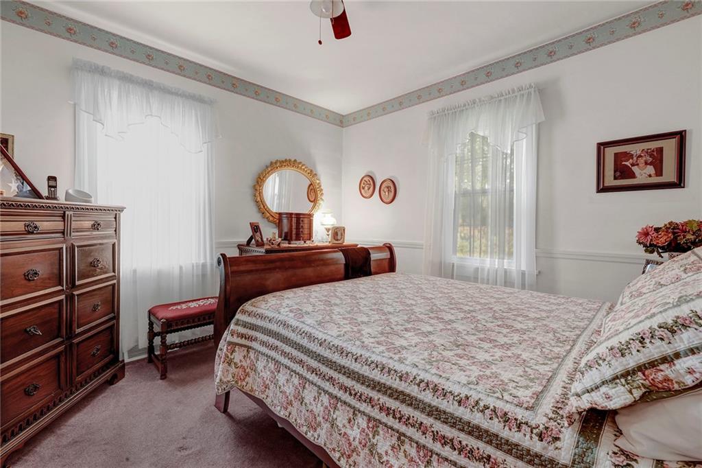 1400 Market Street Beaver, PA 15009 - Photo 9 of 23 a bedroom with a bed and a dresser