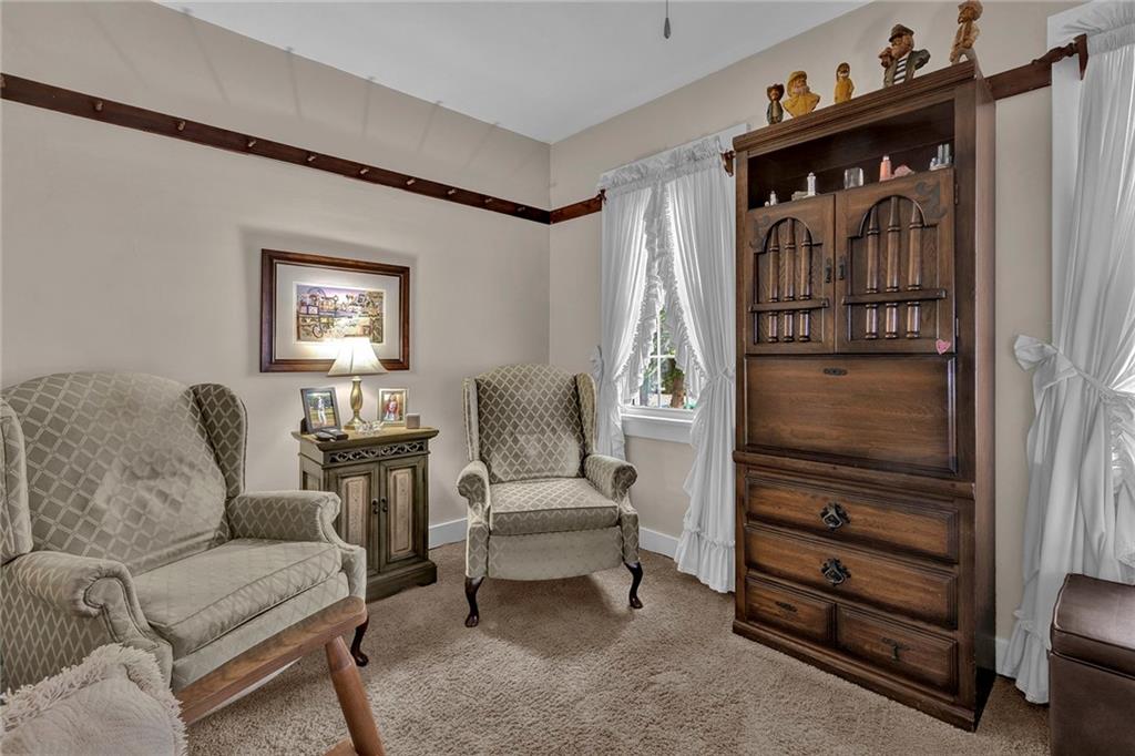 1400 Market Street Beaver, PA 15009 - Photo 10 of 23 a living room with furniture a window and a dresser